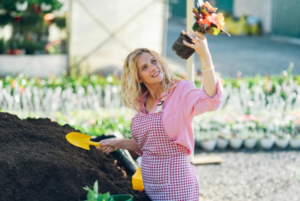 woman-transplanting-pot-plants-