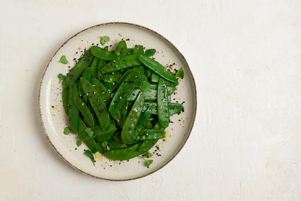 salad of young peas, in pods, with sesame seeds, asian cuisine, homemade,